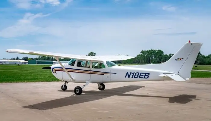 A Cessna 172M parked inside a hangar at a flight school in Fort Worth, Texas.